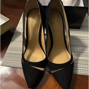 Beautiful black suede heels with mesh openings. 3 1/2 inch heel.  Like new.